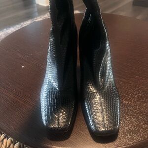 Never worn. In original box. Zipped booties with croc leather design.